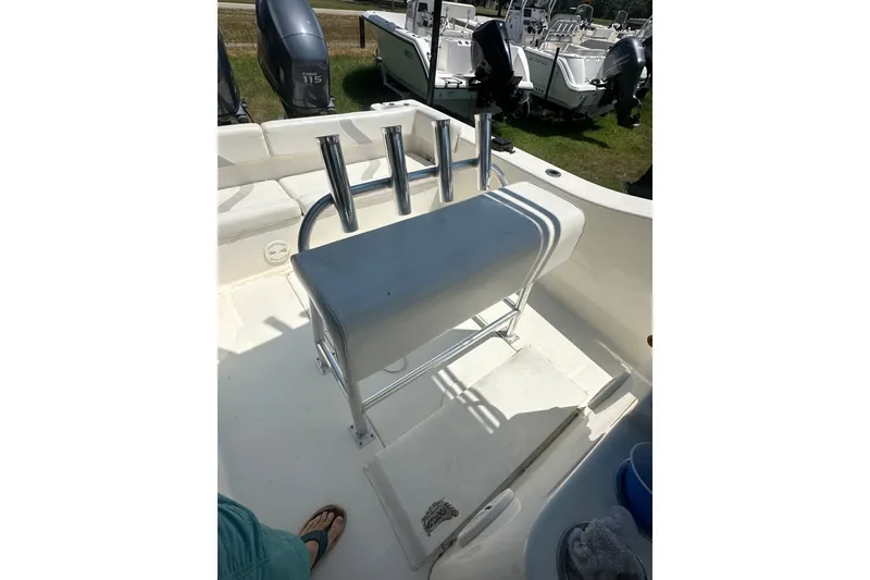Slide: The Image of 2012 Sundance NX25 boat interior with seating and rod holders. - 25