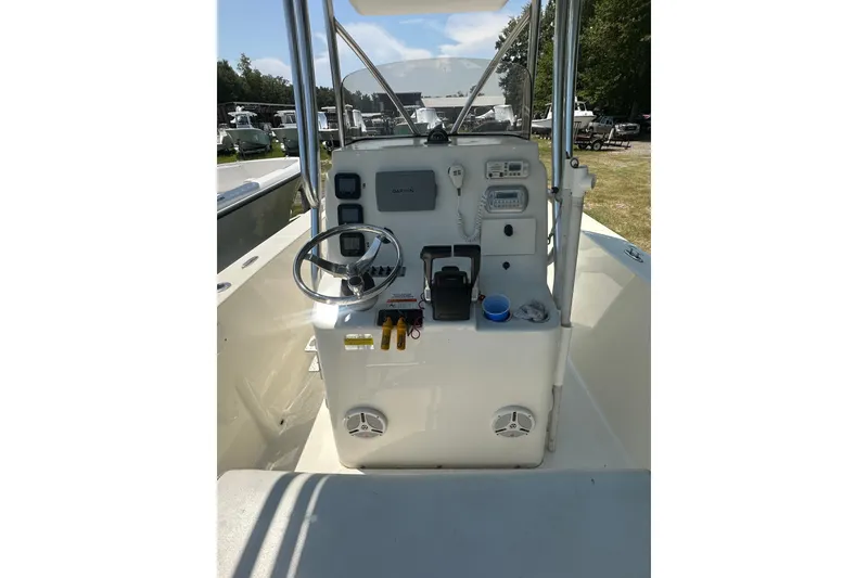 Slide: The Image of 2012 Sundance NX25 boat console with steering wheel and navigation equipment. - 23