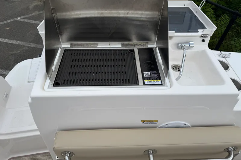 Slide: The Image of Outdoor grill and sink on 2026 Cutwater C-248 Coupe boat deck. - 19