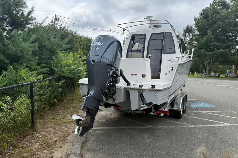 Slide: The Image of 2026 Cutwater C-248 Coupe boat on trailer with powerful outboard motor. - 5