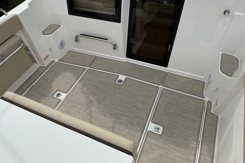 Slide: The Image of 2026 Cutwater C-248 Coupe boat interior with cushioned seating and non-slip flooring. - 9