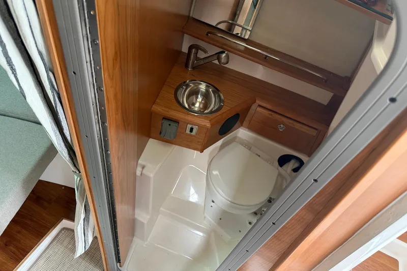 Slide: The Image of Compact bathroom in 2026 Cutwater C-248 Coupe with sink and toilet. - 15