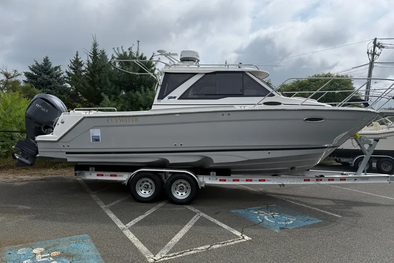 The Image of 2026 Cutwater C-248 Coupe boat on trailer in parking lot. - 0