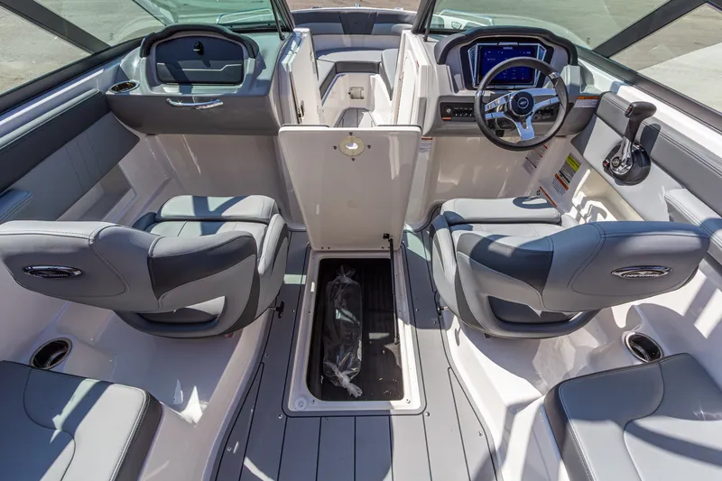 Slide: The Image of 2026 Chaparral 23 SSi boat interior with modern dashboard and seating. - 20