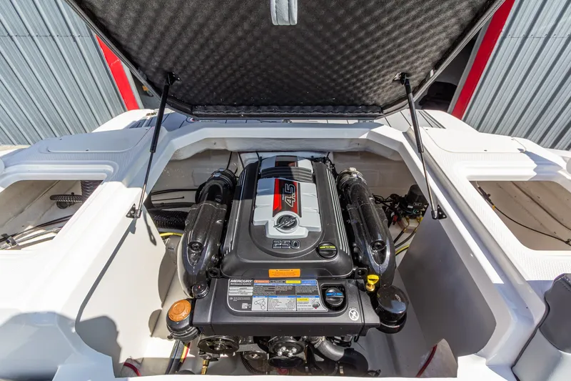 Slide: The Image of Engine compartment of 2026 Chaparral 23 SSi boat, featuring a powerful Mercury engine. - 16