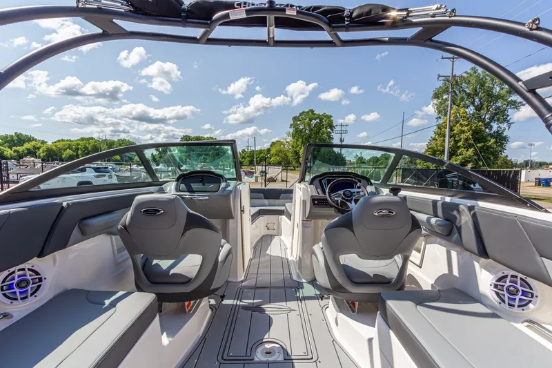 Slide: The Image of Interior view of 2026 Chaparral 23 SSi boat with modern seating and dashboard. - 19