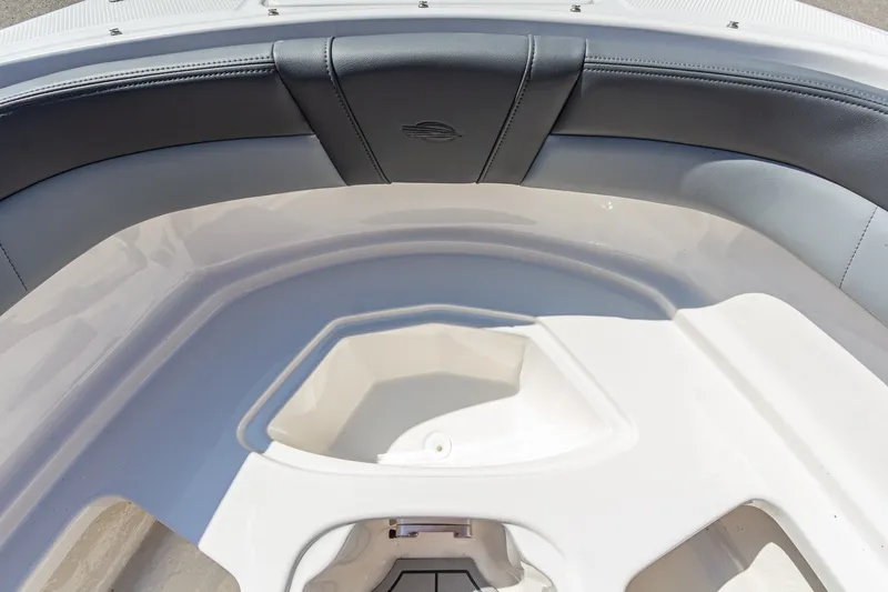 Slide: The Image of Interior view of 2026 Chaparral 23 SSi boat, featuring sleek seating and storage area. - 34