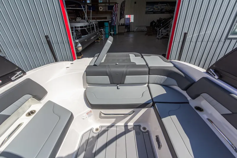 Slide: The Image of 2026 Chaparral 23 SSi boat interior with gray seating and modern design. - 14