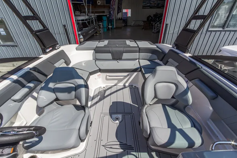 Slide: The Image of Interior of 2026 Chaparral 23 SSi boat with gray seating and modern design. - 21