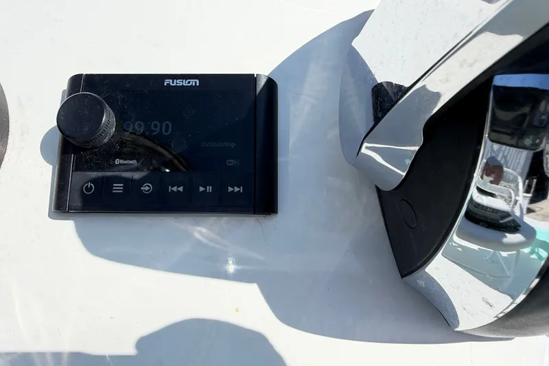 Slide: The Image of Fusion audio control panel on 2023 Egret 21 Moccasin boat dashboard. - 44