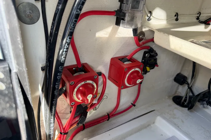 Slide: The Image of Electrical switches and wiring inside a 2023 Egret 21 Moccasin boat. - 38