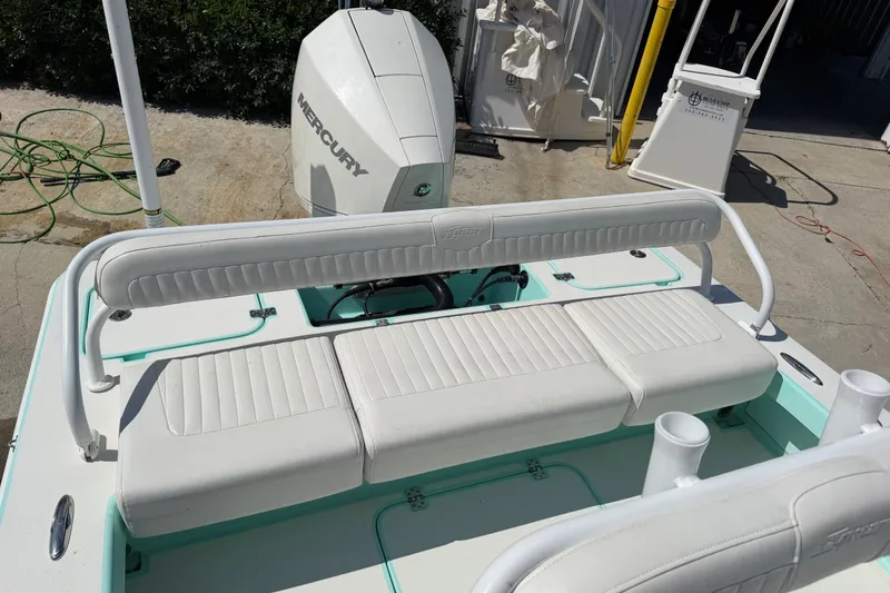 Slide: The Image of 2023 Egret 21 Moccasin boat with Mercury engine and white seating. - 36