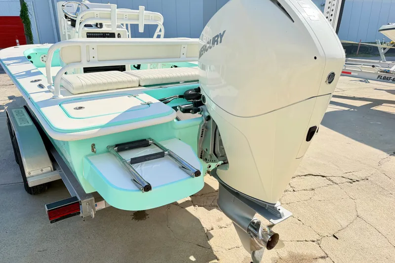 Slide: The Image of 2023 Egret 21 Moccasin boat with Mercury outboard motor, on trailer. - 23