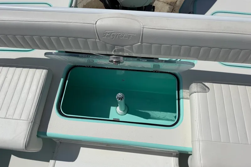 Slide: The Image of Interior view of 2023 Egret 21 Moccasin boat with open storage compartment. - 35