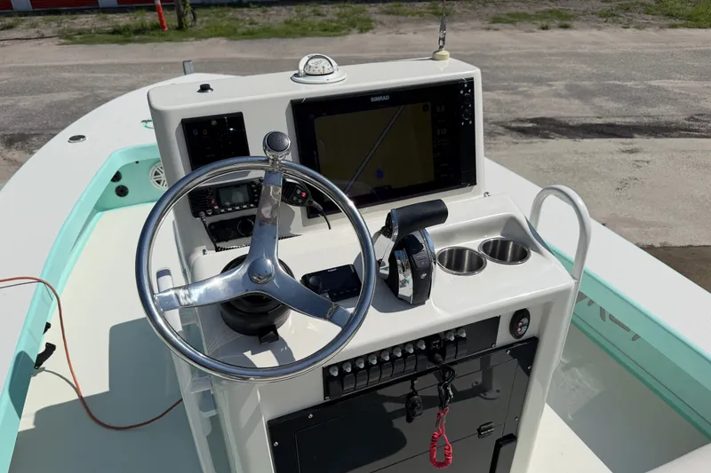 Slide: The Image of Steering console of 2023 Egret 21 Moccasin boat with navigation equipment. - 45