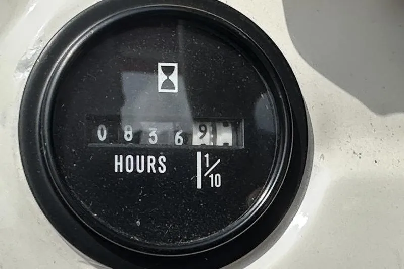 Slide: The Image of Hour meter showing 836.9 hours on a 2006 Larson 180 I/O boat. - 5