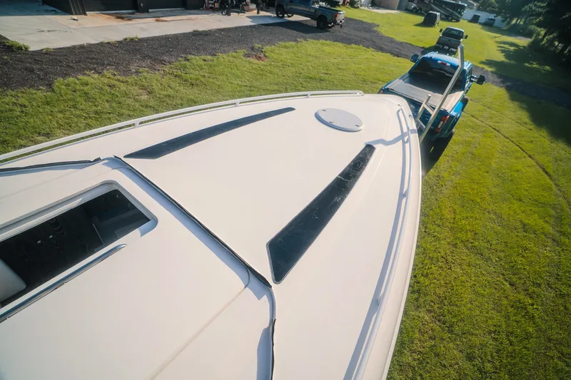 Slide: The Image of A 2020 Concept 44' Cuddy Cabin boat being towed by a blue truck. - 24
