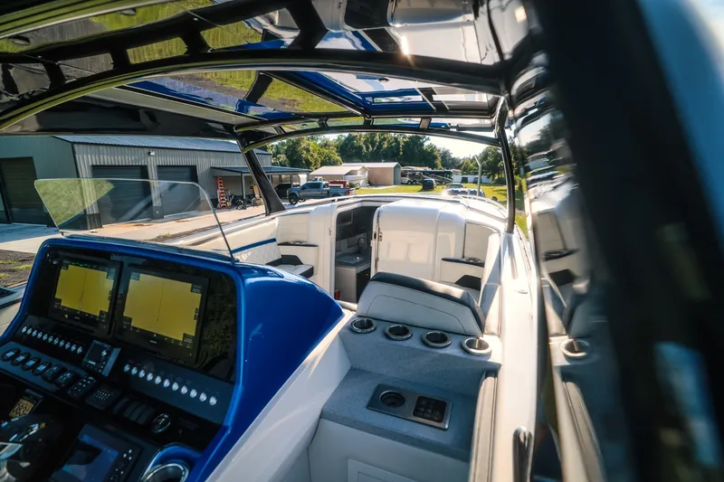 Slide: The Image of Interior view of 2020 Concept 44' Cuddy Cabin boat with modern dashboard and seating. - 48
