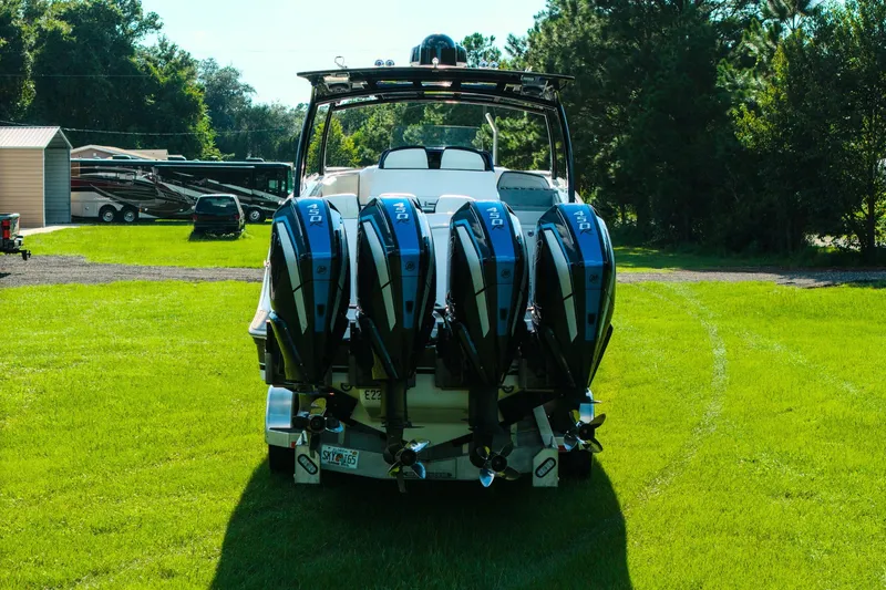 Slide: The Image of 2020 Concept 44' Cuddy Cabin boat with four powerful outboard engines on grassy lawn. - 20
