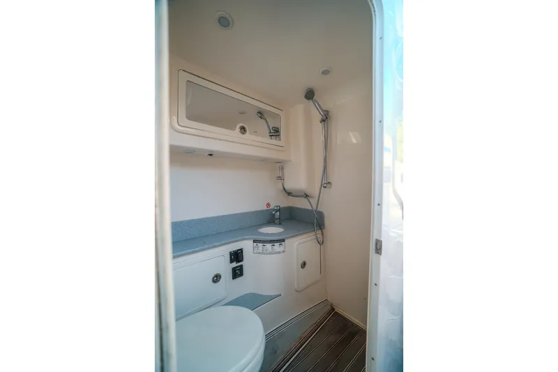 Slide: The Image of 2020 Concept 44' Cuddy Cabin bathroom with shower, sink, and modern fixtures. - 28