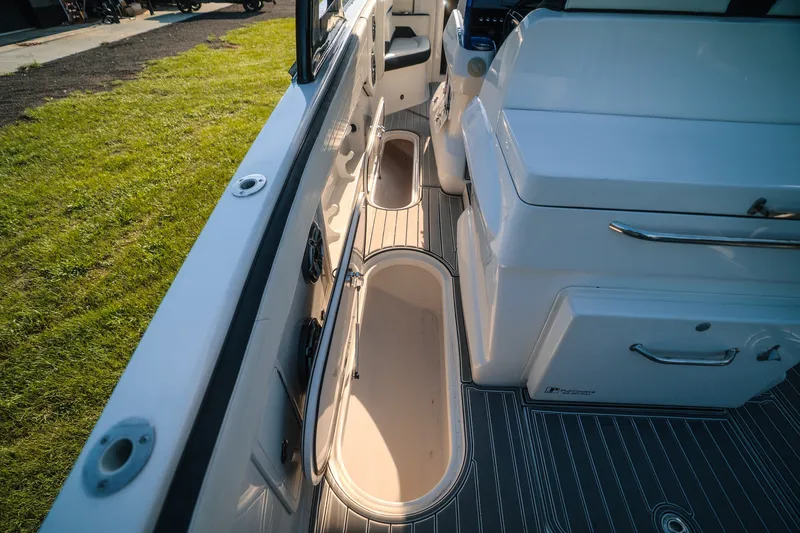 Slide: The Image of Interior view of 2020 Concept 44' Cuddy Cabin boat, featuring sleek seating and storage compartments. - 59