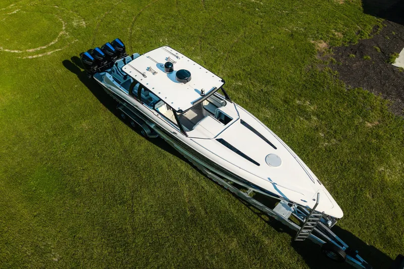 Slide: The Image of Aerial view of 2020 Concept 44' Cuddy Cabin boat on grass with multiple engines. - 10