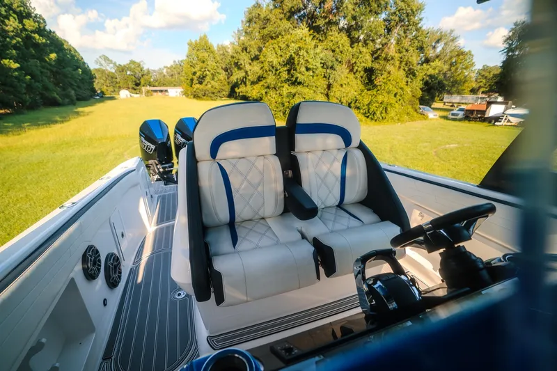 Slide: The Image of Luxurious 2020 Concept 44' Cuddy Cabin boat interior with plush seating and dual engines. - 52