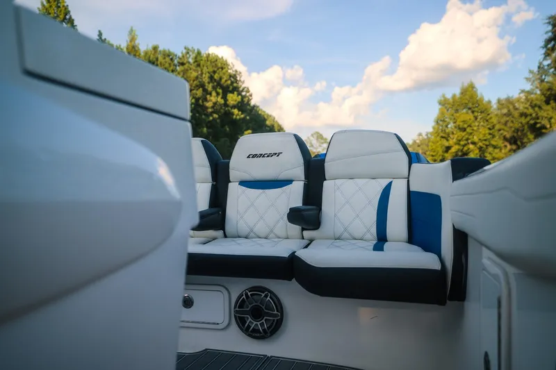 Slide: The Image of Luxurious seating in 2020 Concept 44' Cuddy Cabin boat, featuring elegant white and blue upholstery. - 56
