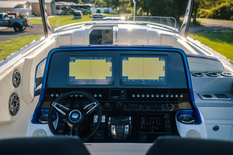Slide: The Image of Interior view of 2020 Concept 44' Cuddy Cabin boat with dual navigation screens. - 44