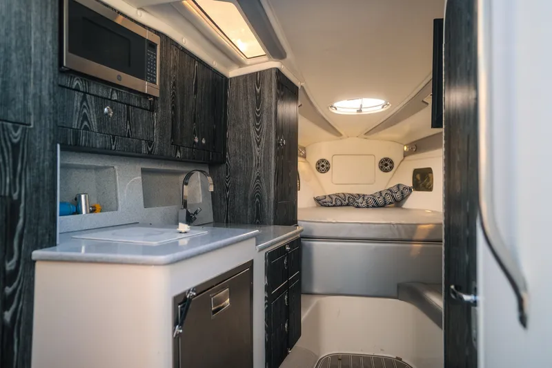 Slide: The Image of Luxurious interior of 2020 Concept 44' Cuddy Cabin with modern kitchenette and cozy sleeping area. - 27