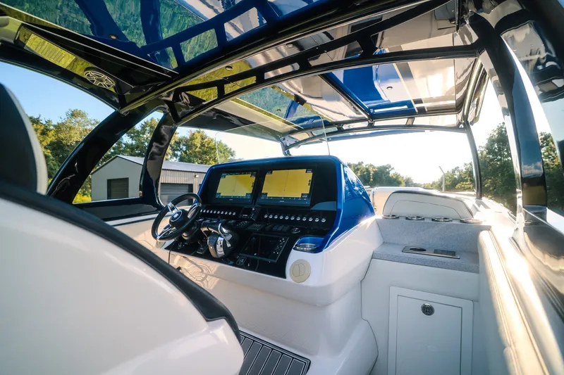 Slide: The Image of Interior view of 2020 Concept 44' Cuddy Cabin boat with modern dashboard and controls. - 42