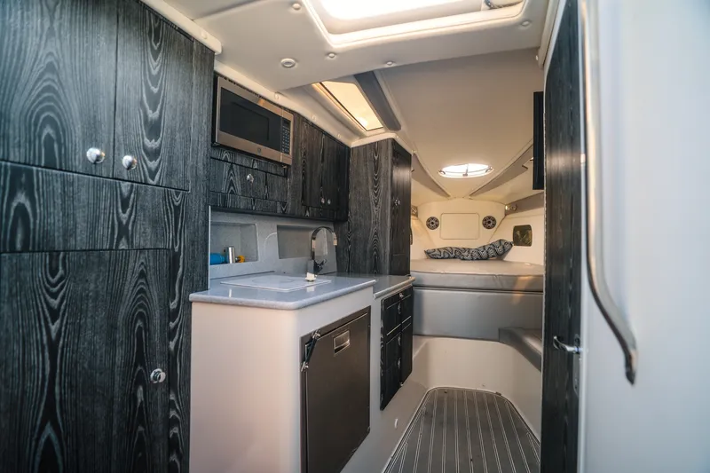 Slide: The Image of Luxurious interior of 2020 Concept 44' Cuddy Cabin with modern kitchen and cozy sleeping area. - 30