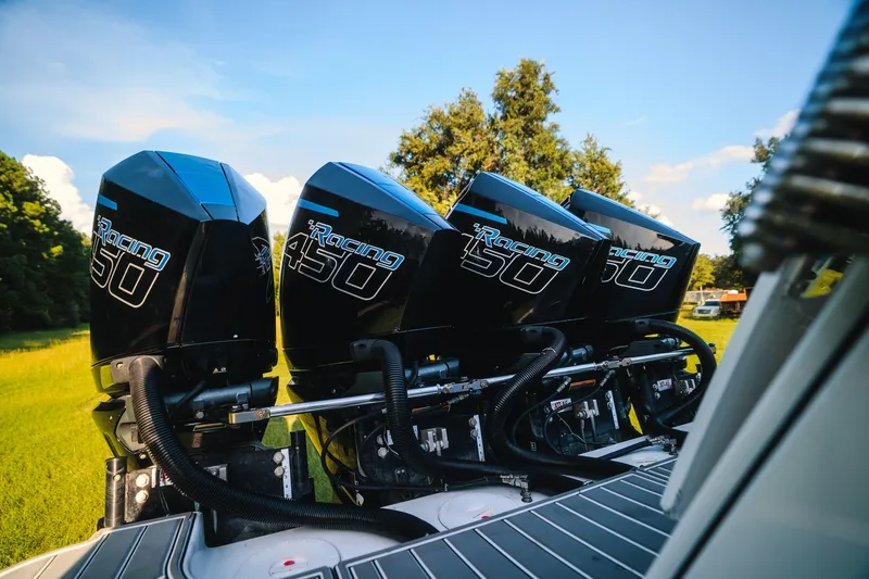 Slide: The Image of Four powerful outboard engines on a 2020 Concept 44' Cuddy Cabin boat. - 55
