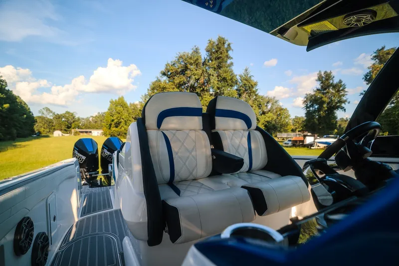 Slide: The Image of Luxurious 2020 Concept 44' Cuddy Cabin boat interior with plush seating and dual engines. - 51