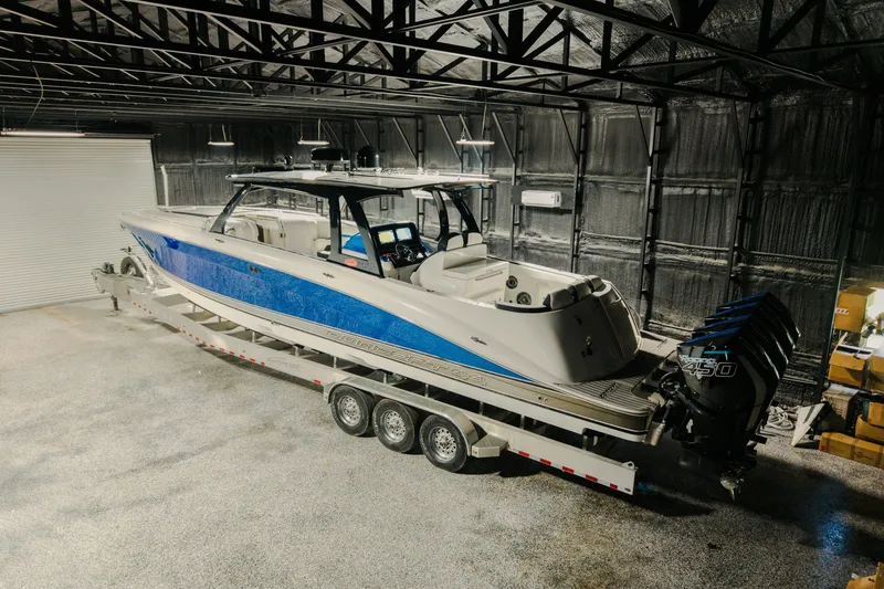 Slide: The Image of 2020 Concept 44' Cuddy Cabin boat in a warehouse, on a trailer. - 68