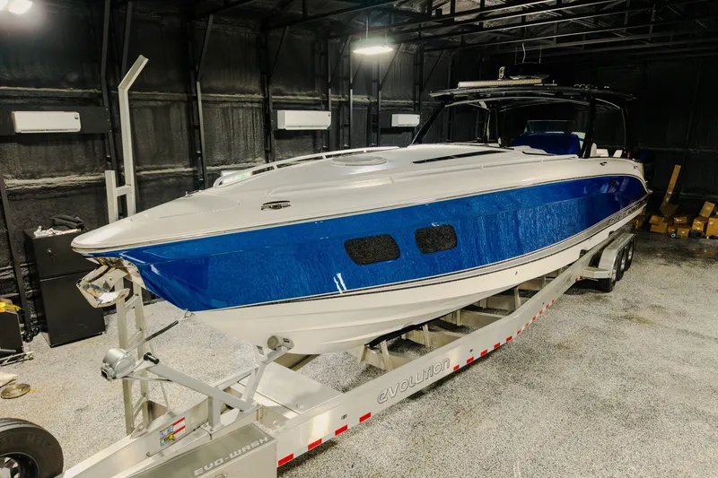 Slide: The Image of 2020 Concept 44' Cuddy Cabin boat on trailer in indoor storage. - 69