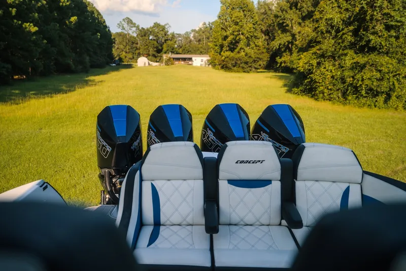 Slide: The Image of 2020 Concept 44' Cuddy Cabin boat with quad outboard engines in a grassy field. - 54