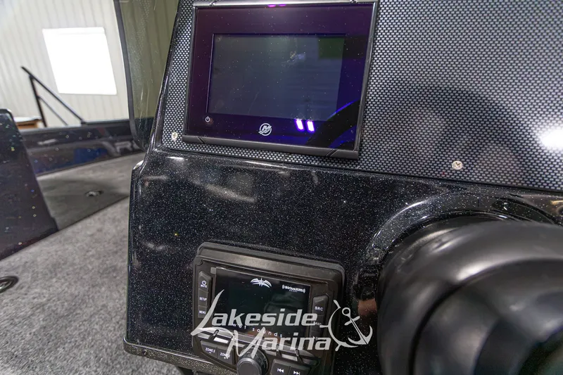 Slide: The Image of Dashboard of a 2027 Recon 985 DC boat with electronic displays. - 23