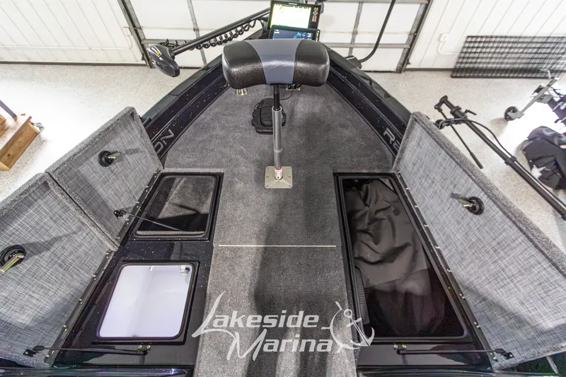 Slide: The Image of Interior view of a 2027 Recon 985 DC boat with storage compartments open. - 28
