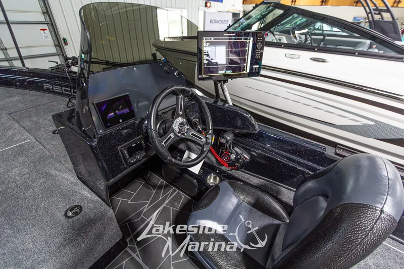 Slide: The Image of Interior of a 2027 Recon 985 DC boat with advanced navigation system. - 20