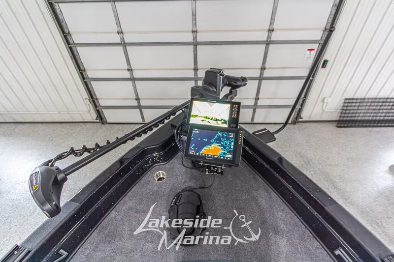 Slide: The Image of 2027 Recon 985 DC boat with advanced navigation system at Lakeside Marina. - 29