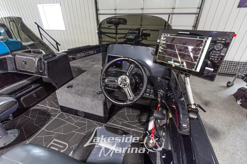 Slide: The Image of Interior of 2027 Recon 985 DC boat with advanced navigation system. - 19