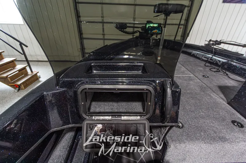 Slide: The Image of 2027 Recon 985 DC boat interior with storage compartment at Lakeside Marina. - 25