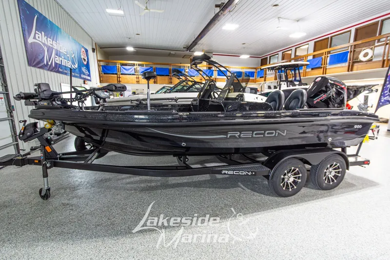 The Image of 2027 Recon 985 DC boat displayed at Lakeside Marina showroom. - 1