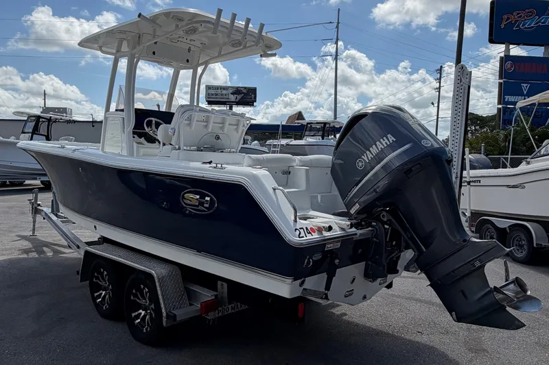 Slide: The Image of 2017 Sea Hunt Ultra 235SE boat with Yamaha engine on trailer. - 2