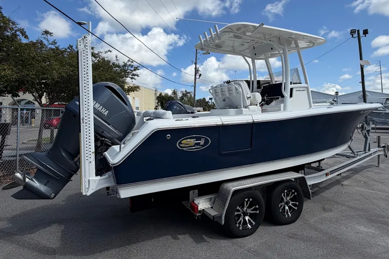 Slide: The Image of 2017 Sea Hunt Ultra 235SE boat on trailer, featuring Yamaha outboard motor. - 1