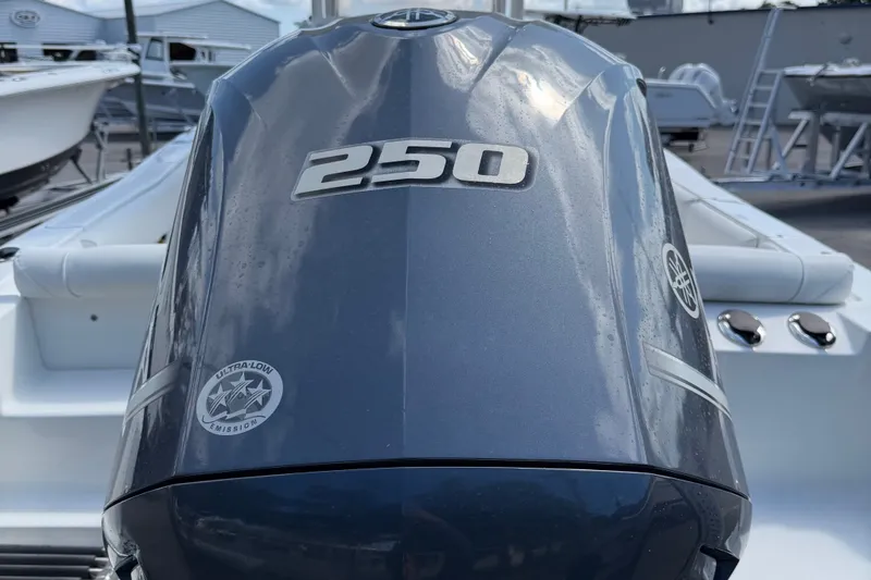 Slide: The Image of Outboard motor on 2017 Sea Hunt Ultra 235SE boat, featuring 250 horsepower. - 4