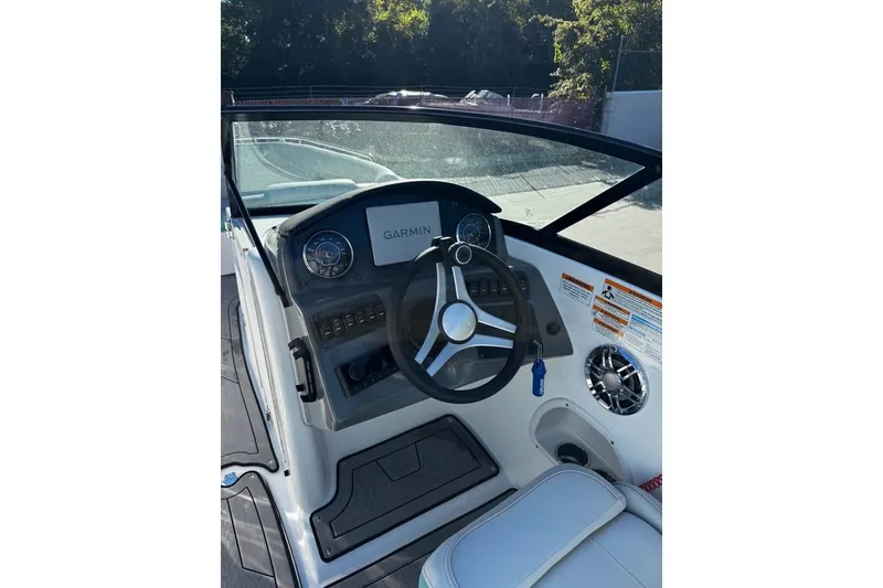 Slide: The Image of 2024 Hurricane SunDeck 2486 OB boat dashboard with Garmin navigation system. - 4