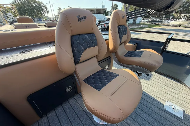 Slide: The Image of Luxury seating on 2027 Ranger 220FC boat, featuring tan and black quilted design. - 19