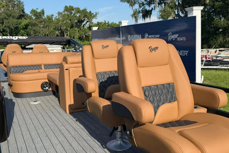 Slide: The Image of Luxurious seating on 2027 Ranger 220FC boat with tan leather and diamond stitching. - 3
